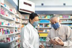 Pharmacist helping customer